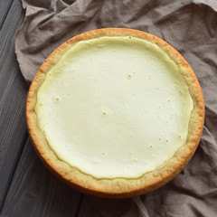 homemade cottage cheese pie on dark flax napkin background
