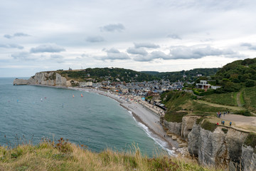 Fototapeta na wymiar view of the rocky beach and seaside resort town of Etretat in Normandy