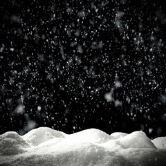 Winter snow flakes with free space for your product. Black background to mount your picture through...