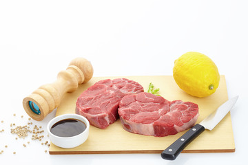 raw meat on a cutting board