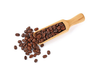 Wooden scoop of roasted coffee beans on white