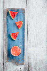 top view of fresh tasty pink watermelon smoothie on wooden background