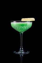 classic grasshopper cocktail with reflection on a dark background