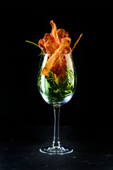 appetizer bacon chips on a dark background
