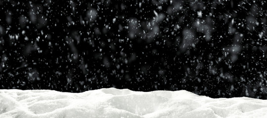Winter snow flakes with free space for your product. Black background to mount your picture through...