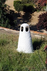 Cave dwelling chimney on the grassy roofs in the Troglodyte Quarter (Barriada de las Cuevas), Guadix, Spain.