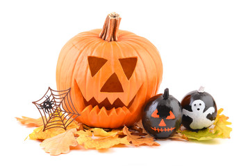 Halloween pumpkin head jack lantern with autumn leaves and spider  isolated on white background . 