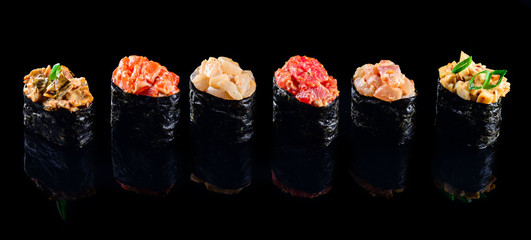 sushi set gunkans on a black background