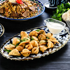 Oriental Fried duchansky chuchvara Dumplings with Minced Meat also known as Gyoza. Close Up. Hot Crunchy Deep-Fried Beef and Mutton Pelmeni