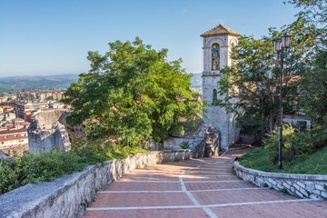 Fototapeta na wymiar Bell tower of San Bartolomeo church and panorama, Campobasso city in Molise