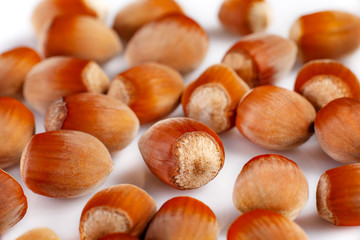 Creative composition made of hazelnut nuts on white background. Food concept.