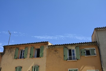 Fototapeta na wymiar Orange House facade in the old town of Saint Tropez, France