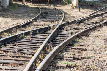 Railroad, rails, old abandoned railway tracks on stone ground
