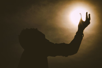 Man holding the sun/moon