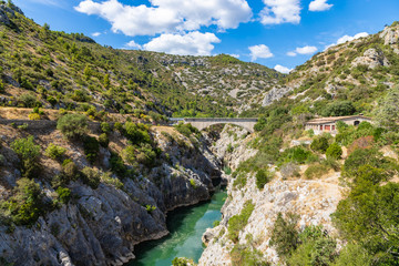 Fototapeta na wymiar View to the new bridge from Le Pont du Diable bridge, situated at the outlet of the Herault Gorges, France