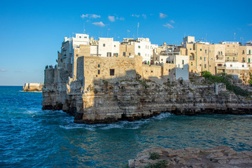 Italy, Polignano a mare, view of the houses overlooking the sea