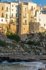 Italy, Polignano a mare, view of the houses overlooking the sea