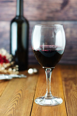 Wine bottle with wineglass corckscrew rustic wooden board, copy space.