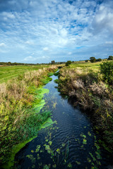 View of the River Brede as it enters Romney Marsh at Brede Bridge, East Sussex, England