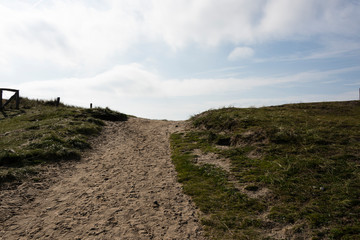 Beautiful tranquil dune landscape and long beach at North Sea