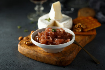 Homemade onion jam served with cheese and nuts