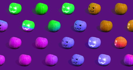Halloween pumpkins Jack o'Lantern on purple background.