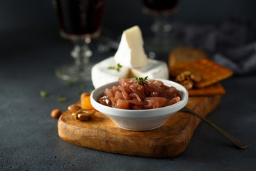 Homemade onion jam served with cheese and nuts
