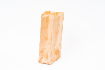 Crumpled brown paper bag on white background