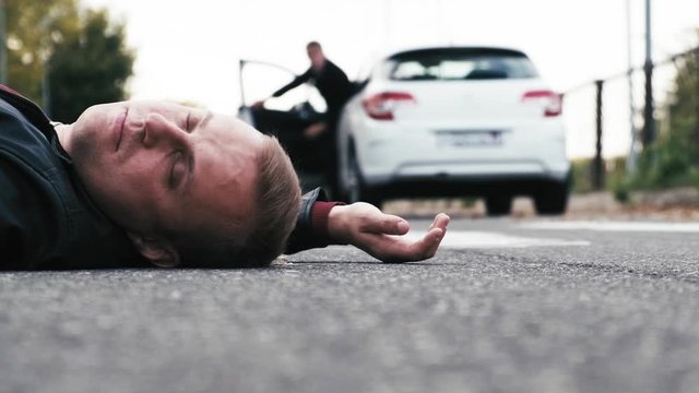 The driver hit a pedestrian and runs out of the car