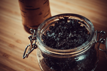 Hookah making on a wooden board and accessories. Hookah bowl and tobacco.