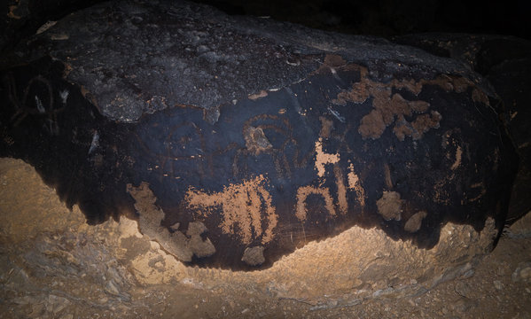 Night  view of a drawing carved in stone by a primitive man in the desert in southern Israel near the Avdat fortress