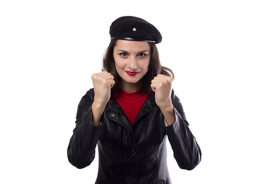 Young woman black jacket, red sweater and hat with a reference to Ernesto Che  Guevara enthusiasm looking in camera, demonstrate her fists and smile on a  white background Photos | Adobe Stock