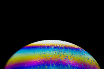 Colorful fantasy planet - soap-bubble abstract on black background