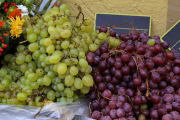 Bunches of grapes lie on the table