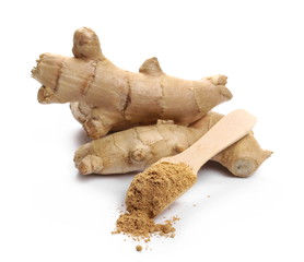Ginger roots and powder with wooden spoon isolated on white background