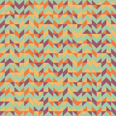 Vector abstract seamless pattern with triangles of different colors. Textile background for package, cover, greeting cards.