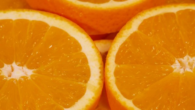 Marco shot of orange fruit and rotate.Close up flesh citrus orange. Nature background.