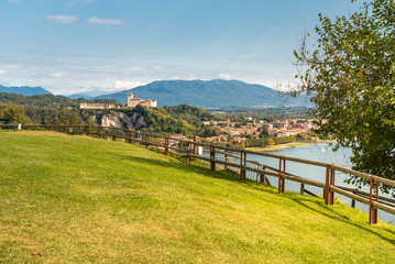 View of Borromeo Castle at Angera from the public park of Rocca Borromeo of Arona, Italy