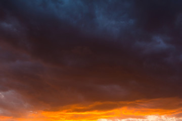 Storm clouds at sunset in bright colors