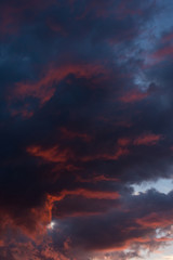 Obraz premium Storm clouds at sunset in bright colors