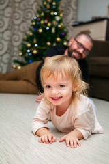 Fototapeta premium cute little girl lying on a floor