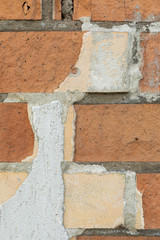 Close-up of brick wall dirty with concrete drips