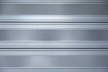 Obraz premium Close-up of shiny metal surface with horizontal stripes