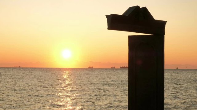 Medium clip of sunrise seen through the Domus Solis in Odessa Ukraine. 