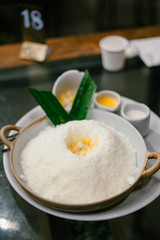 Bingsu or bingsoo is a very popular and elaborate snack/dessert in East Asia especially during the summer season. This snack is composed of ice shavings and various ingredients such as sweetened conde