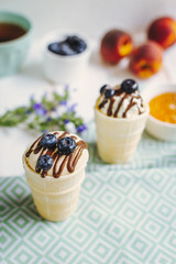 Vanilla ice cream in a waffle cup