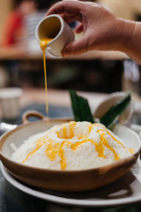 Bingsu or bingsoo is a very popular and elaborate snack/dessert in East Asia especially during the summer season. This snack is composed of ice shavings and various ingredients such as sweetened conde