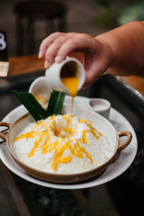 Bingsu or bingsoo is a very popular and elaborate snack/dessert in East Asia especially during the summer season. This snack is composed of ice shavings and various ingredients such as sweetened conde