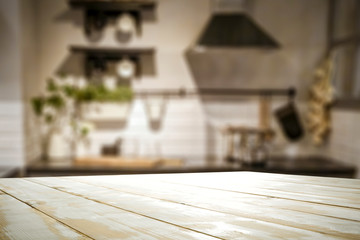 Fototapeta na wymiar White wooden table and kitchen furniture 