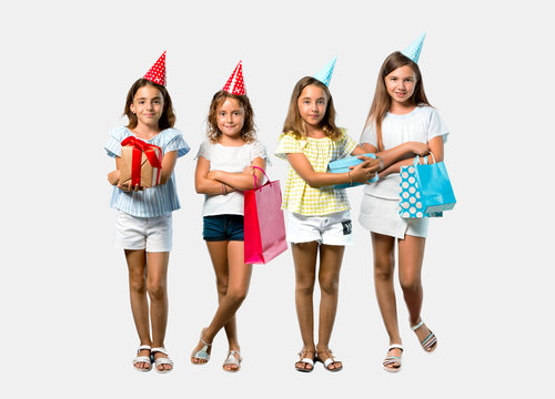 Set of Little girl at a birthday party holding a gift bag keeping arms crossed on grey background